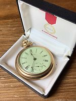 Watch resting in hinged presentation box showing overall appearance