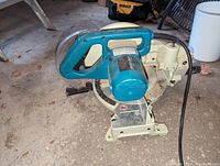Front side view of Makita chop saw showing motor and handle