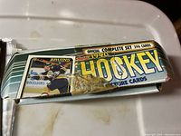 Box of 1990 Topps official complete hockey card set showing box exterior and sticker on front