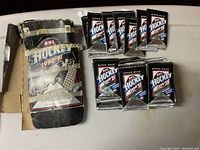 Original box with multiple unopened foil packs beside it.