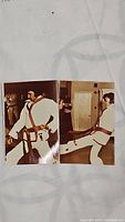 Two vintage color photographs showing Elvis Presley in a white karate gi with a red belt performing karate moves indoors.
