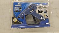 Front view of Surebonder cordless glue gun in packaging showing product name, wattage, and features.