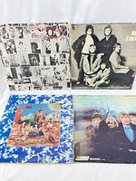 Four vinyl LP albums from The Rolling Stones, showing front covers laid out on a flat surface.