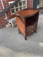 Full view of the Malcolm mid century side table showing shape, drawers, shelf, and extension on the left side.