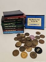 Books by Hazelden stacked, with 'My Mind Is Out To Get Me' box and assorted tokens visible