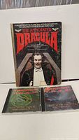 Front cover of The Annotated Dracula book and two Terror T.R.A.X CDs placed beneath