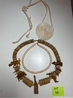 Three necklaces displayed on a white surface.