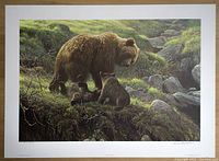 Full view of the unframed print with white borders laid on wooden floor