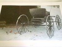 Entire print showing an old horse-drawn buggy on a snowy ground with birds scattered in the foreground.