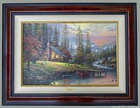 Full view of framed canvas showing overall appearance, burl-style frame and plaque