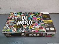 Closed box of DJ Hero for Nintendo Wii with colorful sticker-themed cover art.