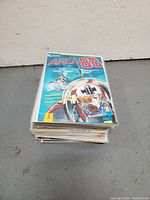 Stack of Area 88 comic books showing the thickness and condition of the set.