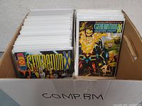 Box with multiple Generation X comic books in white protective sleeves, organized upright.