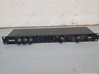 Full front view of Lexicon Alex digital reverb processor showing control knobs, display window, and model branding.