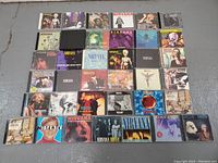 Full layout of 31 Nirvana CDs displaying front cover artwork with albums and singles.