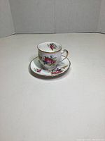 Royal Standard teacup and saucer set on white background, showing floral design and gold trim