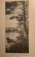Full view of Wallace Nutting signed framed artwork showing the landscape with tree, canoe, and water.