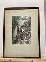 Full view of framed artwork showing entire piece within a wooden frame.