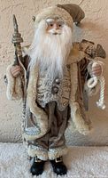 Front view of 18 inch decorative Santa figurine showing detailed face, outfit, staff, and sack.