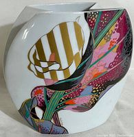 Front view showing colorful floral pattern and overall shape with folded sides.