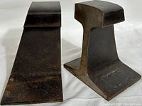 Front view showing the full profile of the two railroad rail iron bookends side by side.