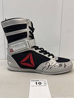 Side view of the signed boxing shoe showing overall design and signature placement