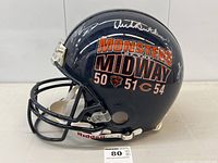 Side view showing ‘Monsters of the Midway 50 51 54’ decal and two silver autographs on navy shell.
