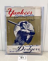 Full front cover of the 1953 program showing team title, illustration and all four autographs