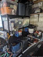 Storage shelf loaded with various items to show size and shelving layout in a garage environment.