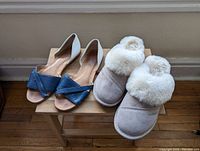 Franco Sarto leather flats paired with Nuknuuk slippers viewed from the front