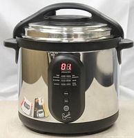 Front view of the Emeril T-Fal electric pressure cooker showing the digital control panel with LED display