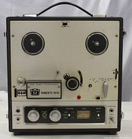 Front view of Roberts Model 1630 reel-to-reel tape recorder showing control panel, tape spindles, and input/output connections.