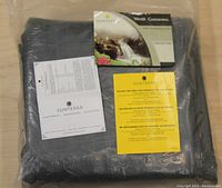 Photo of Sunterra pond liner in clear packaging with accompanying product literature and warranty or usage information displayed on top.