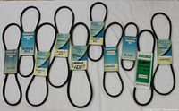 Photo showing 10 new old stock V belts in various sizes with Dayco branded packaging.