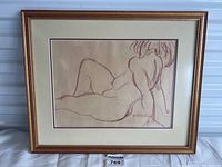 Frontal view of framed sanguine chalk nude drawing