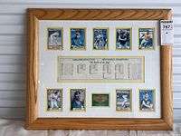 Complete framed collection including 10 gold-bordered baseball cards, center printed 1989 World Champions stats sheet, and green Dream Team Collectibles label. Light wood frame with glass and white/yellow matting.