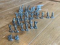 Image showing the full set arranged on a wooden floor, including various soldier poses, cavalry, and artillery pieces.