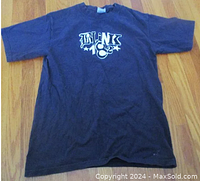 Front of navy blue Blink 182 t-shirt showing logo print