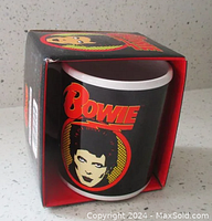 Mug inside original box showing front design with Bowie text and Ziggy Stardust portrait