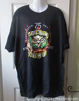Front view of the black XXL Stiff Little Fingers T-shirt with colorful anniversary graphic showing skull, flames, and text 1977-2002.