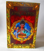 Front cover of the Tarot Apokalypsis hardcover guidebook showing ornate gold detailing with jewel-like accents and central female figure illustration.