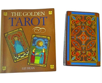 Photo of The Golden Tarot guidebook and tarot cards showing the cover and one card back.