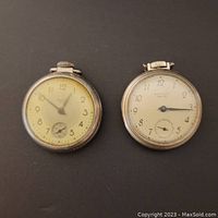 Two silver-tone Westclox pocket watches displayed side by side, showing faces and condition.