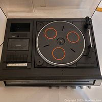 Top view of Dorchester MC-900 showing belt drive turntable with platter and tonearm on right, cassette deck on left.