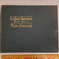 Front cover of the book 'Earthly Footsteps Of The Man Of Galilee' showing wear and gold embossed title.