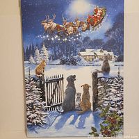 Front view of the Christmas canvas painting showing animals watching Santa Claus in his sleigh over a snowy gate at night.