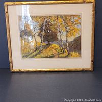Frontal view of the custom framed watercolor painting showing a fall scene with birch trees and hills.