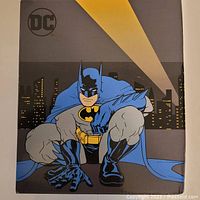 Box front showing Batman crouched with Gotham skyline behind and DC logo