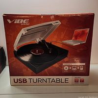 Box packaging of Vibe Sound USB turntable showing the product image and model.