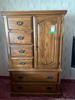 Front full view showing all drawers and cabinet door.